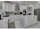 Spacious kitchen with white cabinets, stainless steel appliances, and marble countertops at , Las Vegas, NV 89128