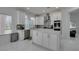 Well-lit kitchen with white cabinets, stainless steel appliances, and island at 2604 Sun Reef Rd, Las Vegas, NV 89128