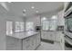 Modern kitchen featuring white cabinets, quartz countertops, and an island at , Las Vegas, NV 89128