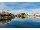 The tranquil water view features waterfront homes and a community center reflected on the water's surface at 2604 Sun Reef Rd, Las Vegas, NV 89128