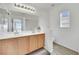 Double vanity bathroom with modern fixtures at 10424 Wyatt Earp Ct, Las Vegas, NV 89129