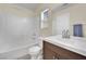 Bright bathroom featuring a shower-tub combo with a white vanity and neutral color palette at 10424 Wyatt Earp Ct, Las Vegas, NV 89129