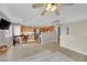 Open-concept living space featuring wood floors, natural light, and a kitchen view at 10424 Wyatt Earp Ct, Las Vegas, NV 89129