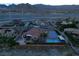 Aerial view of house, pool, and surrounding area at 10470 W Ann Rd Rd, Las Vegas, NV 89149