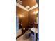 Small bathroom with brown walls and updated fixtures at 10470 W Ann Rd Rd, Las Vegas, NV 89149