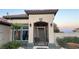 Elegant entryway with an ornate gate and well-lit exterior at 10470 W Ann Rd Rd, Las Vegas, NV 89149