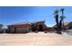 Single-story house with a two-car garage and desert landscaping at 10470 W Ann Rd Rd, Las Vegas, NV 89149