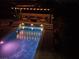 Luxury pool with lighting and patio at night at 10470 W Ann Rd Rd, Las Vegas, NV 89149