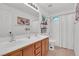 Double vanity bathroom with wood cabinets and shower at 10636 Amblewood Way, Las Vegas, NV 89144