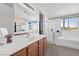 Elegant bathroom with double vanity, soaking tub, and shower at 10636 Amblewood Way, Las Vegas, NV 89144