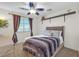 Cozy bedroom with window, ceiling fan and plush bedding at 10636 Amblewood Way, Las Vegas, NV 89144