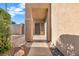 Welcoming front entry with covered walkway and landscaping at 10636 Amblewood Way, Las Vegas, NV 89144