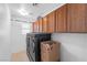 Laundry room with washer, dryer and cabinets at 10636 Amblewood Way, Las Vegas, NV 89144