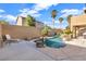 Stunning pool with rock features and a spacious patio area at 10636 Amblewood Way, Las Vegas, NV 89144