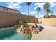 Relaxing spa with waterfall feature adjacent to the pool at 10636 Amblewood Way, Las Vegas, NV 89144