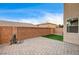 Private backyard with paved patio, artificial turf, and a wall for privacy at 10636 Tulip Valley Rd, Las Vegas, NV 89179