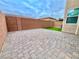 Private backyard with paver patio and artificial turf at 10636 Tulip Valley Rd, Las Vegas, NV 89179