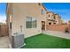 Artificial turf backyard with patio and AC unit at 10636 Tulip Valley Rd, Las Vegas, NV 89179