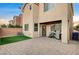 Artificial turf backyard with patio and grill at 10636 Tulip Valley Rd, Las Vegas, NV 89179