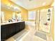 Elegant bathroom with double sinks, bathtub, and shower at 10636 Tulip Valley Rd, Las Vegas, NV 89179