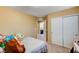 Bedroom with double bed, closet, and view of bathroom at 10636 Tulip Valley Rd, Las Vegas, NV 89179