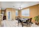 Cozy dining area with a heart-shaped table and four chairs at 10636 Tulip Valley Rd, Las Vegas, NV 89179