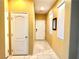 Neutral-toned hallway with tile flooring and extra storage at 10636 Tulip Valley Rd, Las Vegas, NV 89179