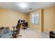 Home office with a large desk and comfortable chair at 10636 Tulip Valley Rd, Las Vegas, NV 89179