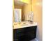 Well-appointed powder room with dark vanity and decorative plants at 10636 Tulip Valley Rd, Las Vegas, NV 89179