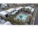 Community pool and surrounding homes with palm trees at 11287 Idyllic Dr # 102, Las Vegas, NV 89135