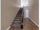 Modern staircase with carpet runner and metal railing at 11287 Idyllic Dr # 102, Las Vegas, NV 89135