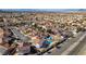 Aerial view of a densely populated residential area with red-tiled roofs near roadways at 1138 Gainesborough Ct, Henderson, NV 89015