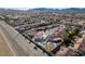 Homes with private pools are visible in this aerial shot of the neighborhood and mountain backdrop at 1138 Gainesborough Ct, Henderson, NV 89015