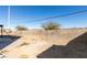 Fenced backyard with desert landscaping and partial patio at 1138 Gainesborough Ct, Henderson, NV 89015