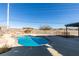 A backyard pool area with mature landscaping and desert views at 1138 Gainesborough Ct, Henderson, NV 89015