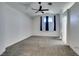 Bedroom with a ceiling fan, neutral walls, carpeted flooring, and a window at 1138 Gainesborough Ct, Henderson, NV 89015