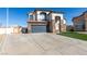 Two-story stucco home featuring a tile roof and a three-car garage at 1138 Gainesborough Ct, Henderson, NV 89015