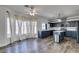 View of kitchen featuring wood floors, island, modern appliances, and lots of natural light at 1138 Gainesborough Ct, Henderson, NV 89015