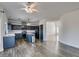 Modern kitchen with center island, stainless steel appliances, and wood floors, offering plenty of space at 1138 Gainesborough Ct, Henderson, NV 89015