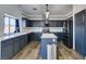 Kitchen featuring a center island, stainless steel appliances, modern lighting and ample counter space at 1138 Gainesborough Ct, Henderson, NV 89015