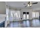 Spacious living room features wood floors, neutral walls, and large windows with natural light at 1138 Gainesborough Ct, Henderson, NV 89015