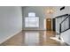 Bright living room features wood floors, high ceilings, large windows, and modern chandelier at 1138 Gainesborough Ct, Henderson, NV 89015