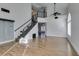 Spacious living room boasting wood flooring, modern staircase and abundant natural light at 1138 Gainesborough Ct, Henderson, NV 89015