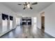 View of open floorplan, with wood floors, neutral walls, and access to a modern kitchen at 1138 Gainesborough Ct, Henderson, NV 89015