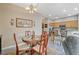 Charming dining area with wood table and kitchen access at 114 Harbor View Dr # 1025, Boulder City, NV 89005