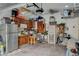 Organized garage with overhead storage and workbench at 114 Harbor View Dr # 1025, Boulder City, NV 89005