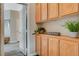 Hallway with built-in wooden cabinets and plants at 114 Harbor View Dr # 1025, Boulder City, NV 89005