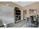 Well-lit home office with built-in shelving and wood-look floors at 114 Harbor View Dr # 1025, Boulder City, NV 89005