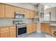 Well-equipped kitchen with stainless steel appliances and oak cabinets at 114 Harbor View Dr # 1025, Boulder City, NV 89005