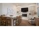 Wet bar with seating area, fireplace, and built-in shelving at 12 Bloomfield Hills Dr, Henderson, NV 89052